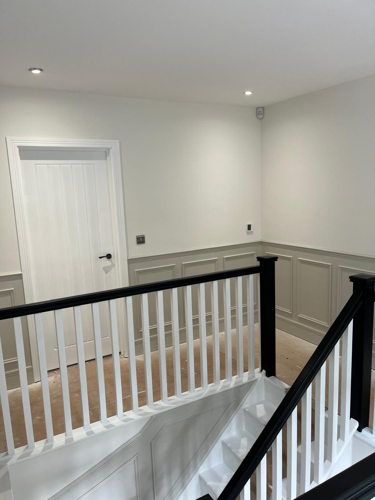 Panelled landing with two-tone walls