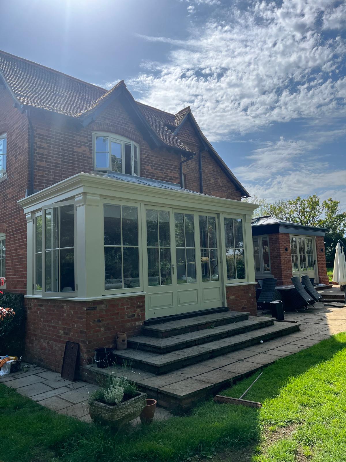 Repainted orangery & sash windows in heritage cream