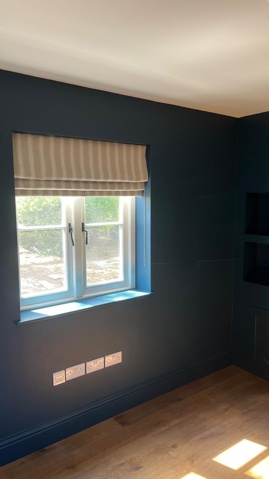 Inky-blue snug with restored sash window